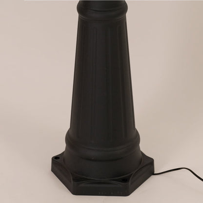 Detailed closeup of black lamppost lantern highlighting metal frame and clear glass for traditional garden and patio lighting.