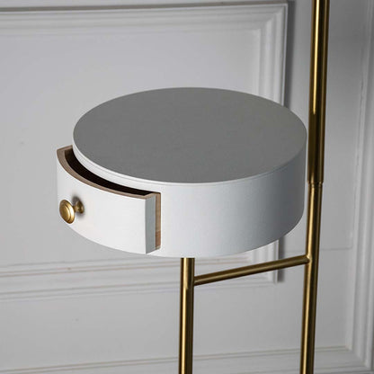 Closeup view of the lamp golden brass base and white globe shade focusing on craftsmanship and minimalist elegance.