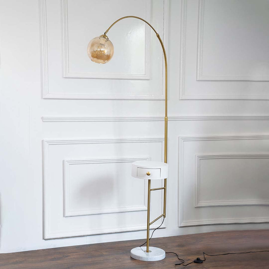 Elegant product display of a floor lamp turned off with a white globe shade standing on a clean white background with minimal decor.