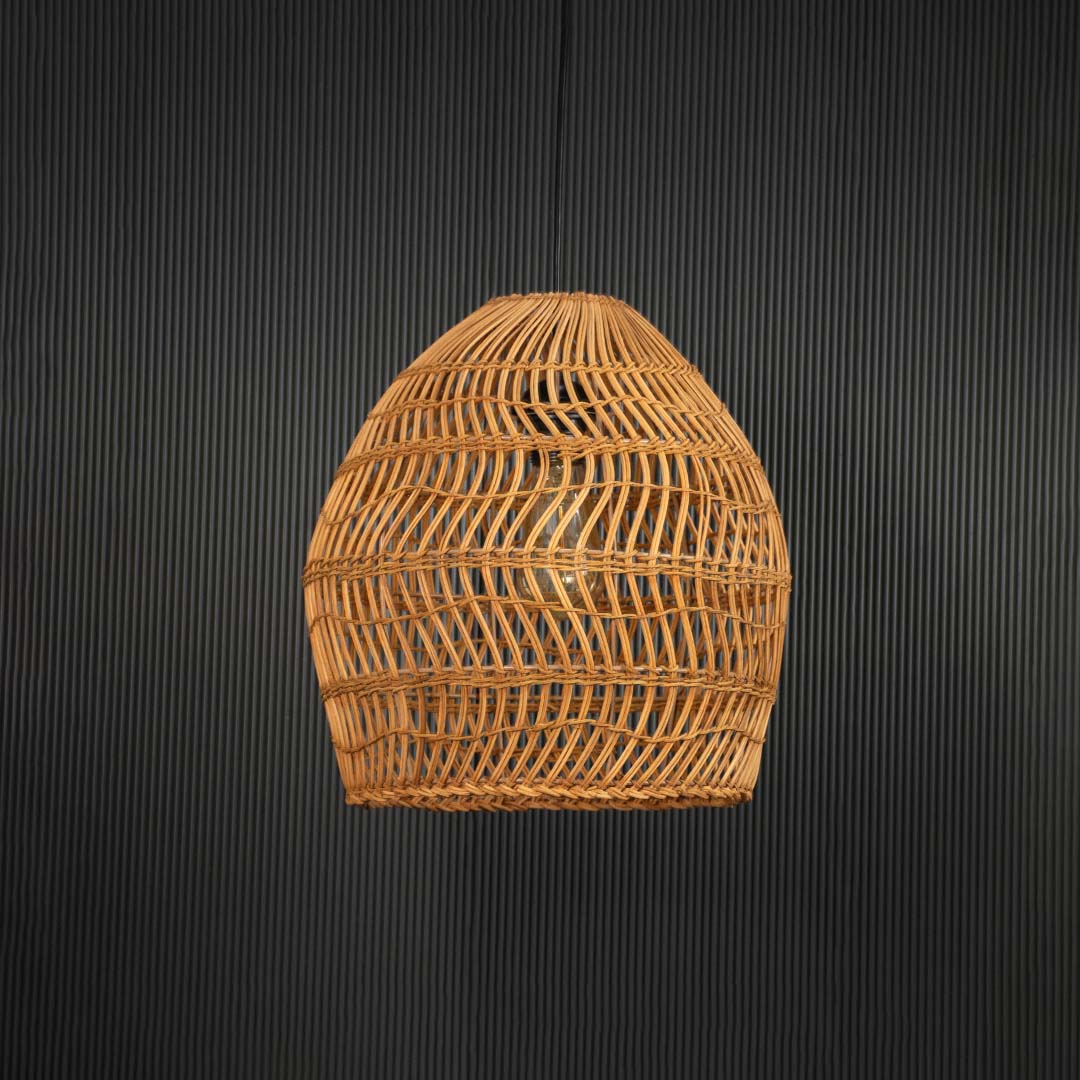 Open weave rattan pendant light with handwoven bamboo shade in natural finish turned off against black background.