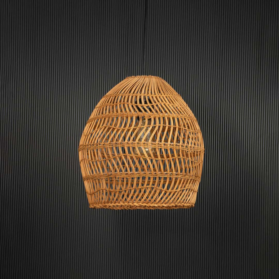 Open weave rattan pendant light with handwoven bamboo shade in natural finish turned off against black background.