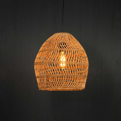 Open weave rattan pendant light with handwoven bamboo shade turned on glowing softly against plain black background.