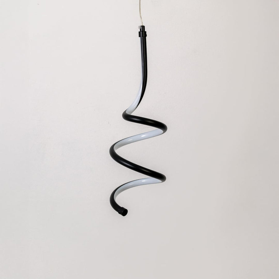 Modern black and white metal spiral hanging light shown switched off on white background for minimal wall decor.