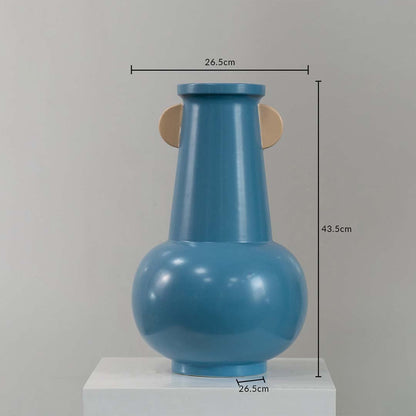 Blue sculptural metal vase shown with 43.5 cm height and 26.5 cm width offering a clear accurate size reference.