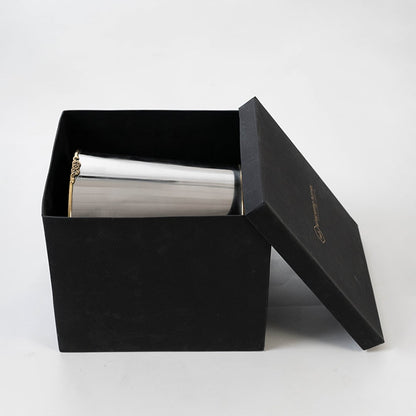 Stainless steel silver cup inside sleek black box packaging for premium presentation and safe storage.