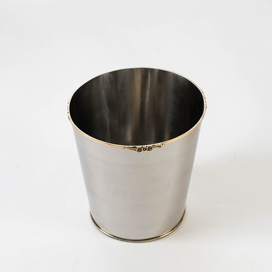 Stainless steel silver cup isolated on pure white background highlighting shape surface and open top design.