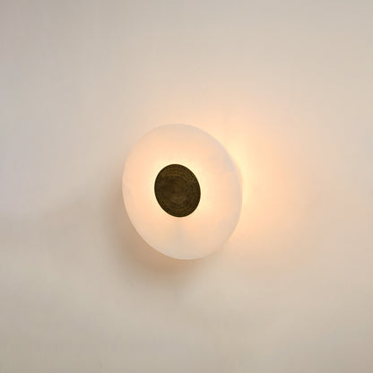 Modern white marble wall light with warm ambient glow for elegant hallway and luxury decor styling spaces.