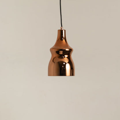 Copper metal pendant light on a white background with the light off highlighting its sleek modern shape and polished surface.