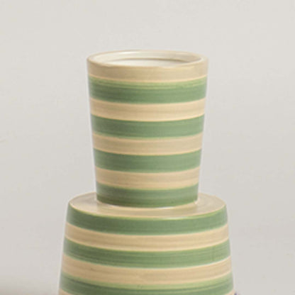 Closeup view of a green and beige striped ceramic vase highlighting its smooth texture  tapered form  and clean handcrafted detailing.
