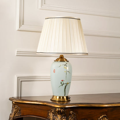 Unlit floral ceramic lamp with cream shade and gold base retains artistic beauty and decorative appeal making interiors look effortlessly elegant.