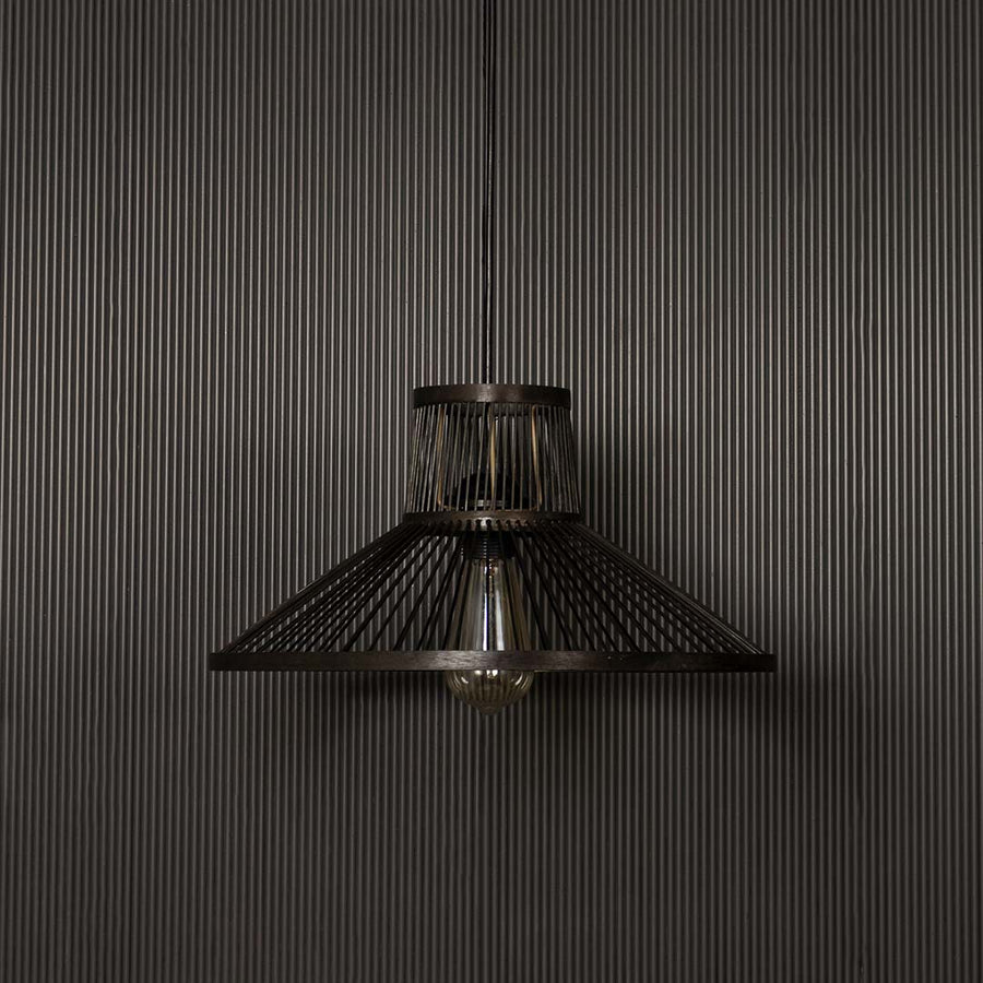 Black wire pendant light on dark background highlighting its geometric cone shape and matte metal finish.