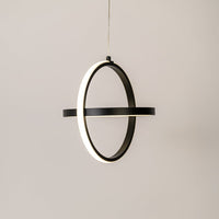 Black metal ring wall light with warm illumination for modern bedroom hallway and living room decor.