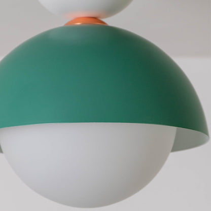 Closeup view of the green dome ceiling light highlighting its smooth finish and round white globe design.