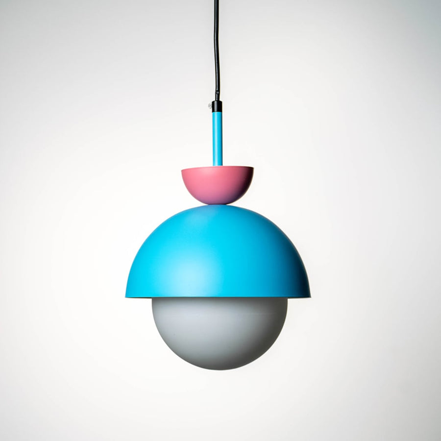Blue metal pendant light with pink top and white diffuser designed for vibrant interiors.