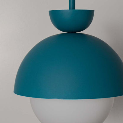 Closeup of blue metal pendant light with frosted white diffuser showcasing premium craftsmanship.