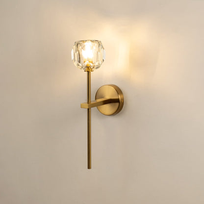 Contemporary brass wall light with crystal glass shade for elegant bedroom and hallway decor.