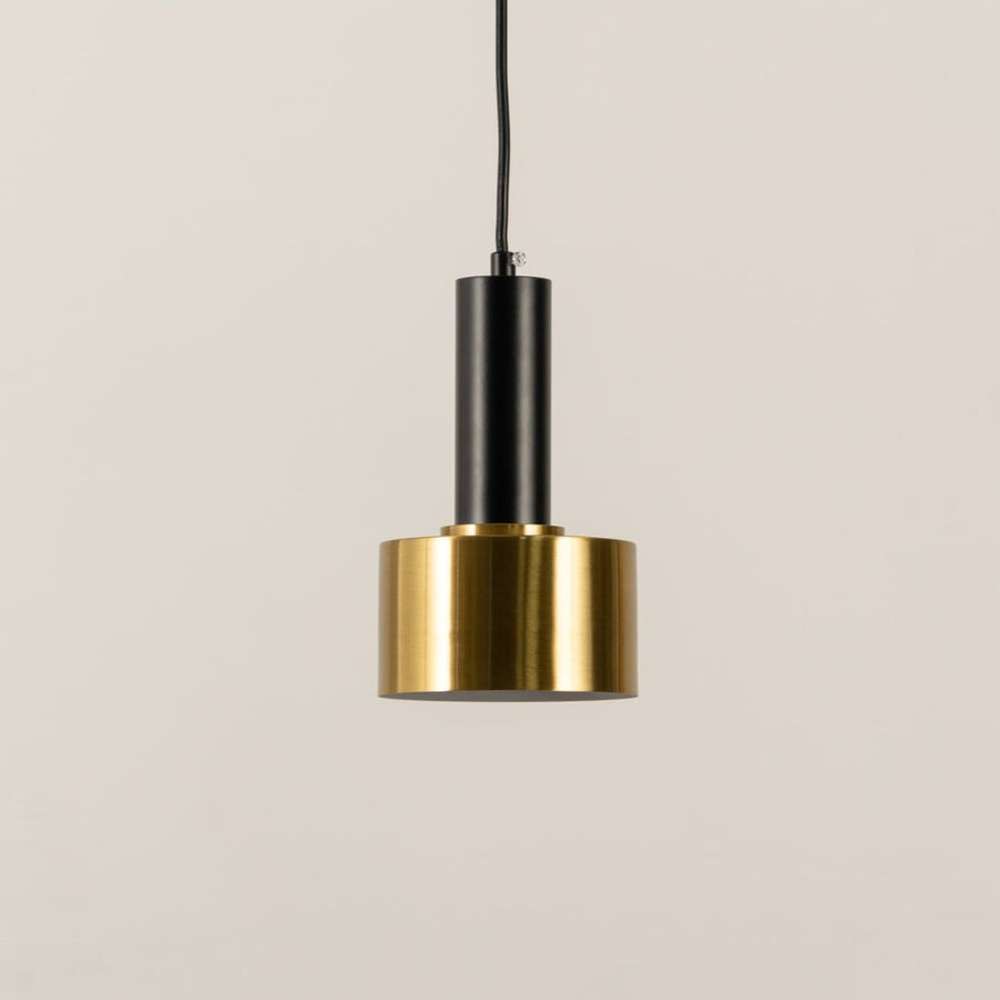 Gold and black metal pendant light with bulb switched off displayed on a white background showcasing its sleek compact form for home interiors.