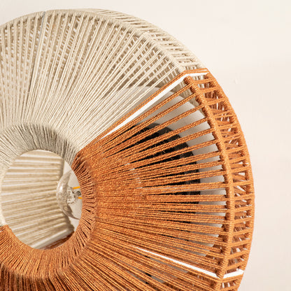 Closeup of woven wall decor with natural fiber texture showcasing intricate pattern and warm tone for modern interior wall styling.
