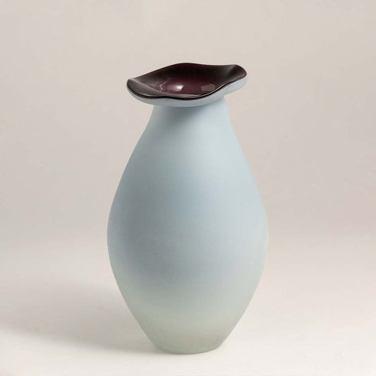 White ceramic decorative vase with maroon rim and organic silhouette for modern shelf styling and home decor.