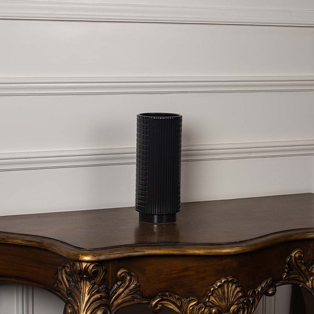 Black textured ceramic vase displayed on a clean white background ideal for minimal home decor and sleek tabletop styling.