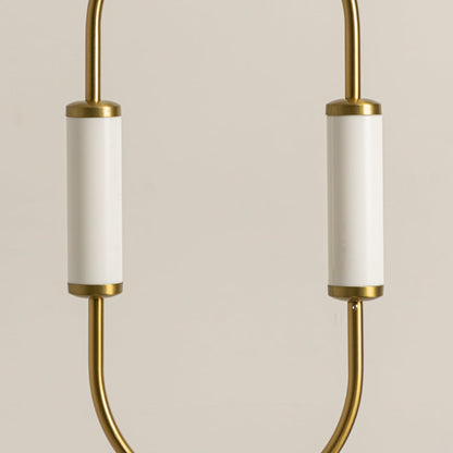 Close up view of brass gold pendant light fixture showing white glass shades and metal frame craftsmanship detail work.