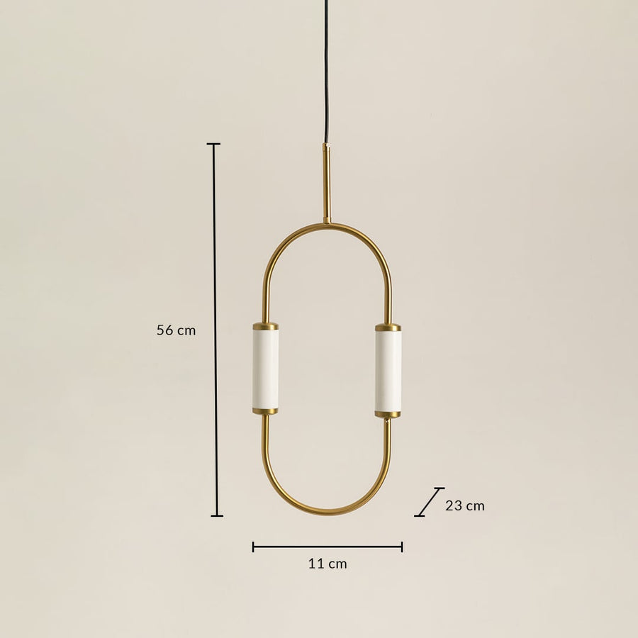 Modern oval brass pendant light with white cylinder shades measuring 56cm height 23cm width and 11cm depth dimensions.