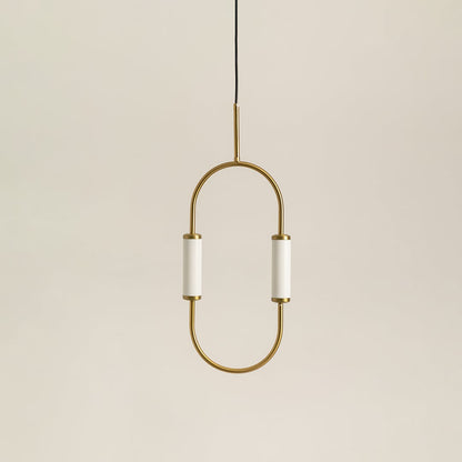 Modern dual light brass pendant chandelier with white cylindrical shades switched off on minimal white backdrop display.