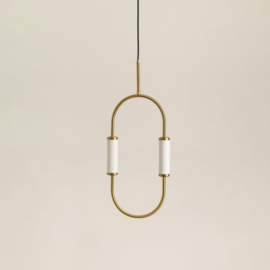 Modern dual light brass pendant chandelier with white cylindrical shades switched off on minimal white backdrop display.