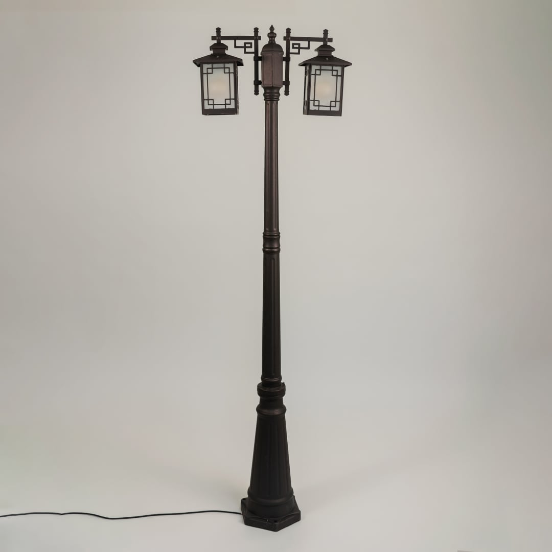 Vintage outdoor street lamp with dual lantern shades for elegant exterior decor styling use.