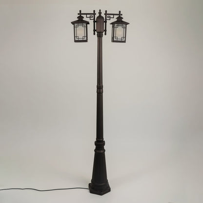 Vintage outdoor street lamp with dual lantern shades for elegant exterior decor styling use.
