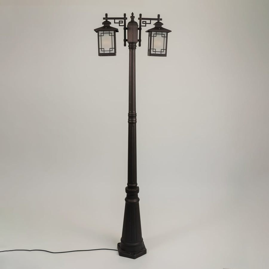 Vintage outdoor street lamp with dual lantern shades for elegant exterior decor styling use.