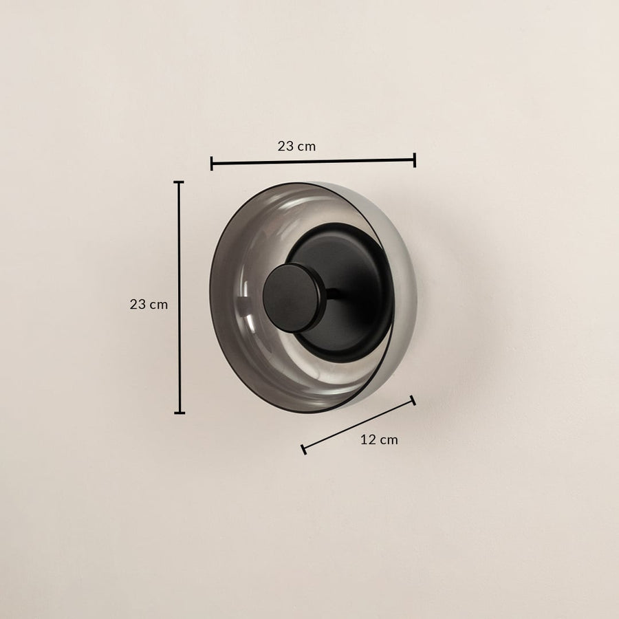 Round smoke glass wall light fixture showing a twenty-three centimeter height measurement mark on a plain background.