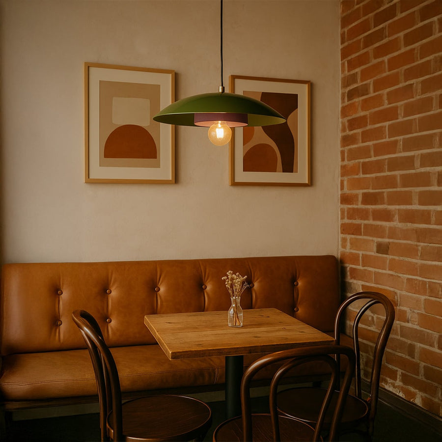 Green metal pendant light with lavender inner plate adding modern style to living room dining area and home interior decor.