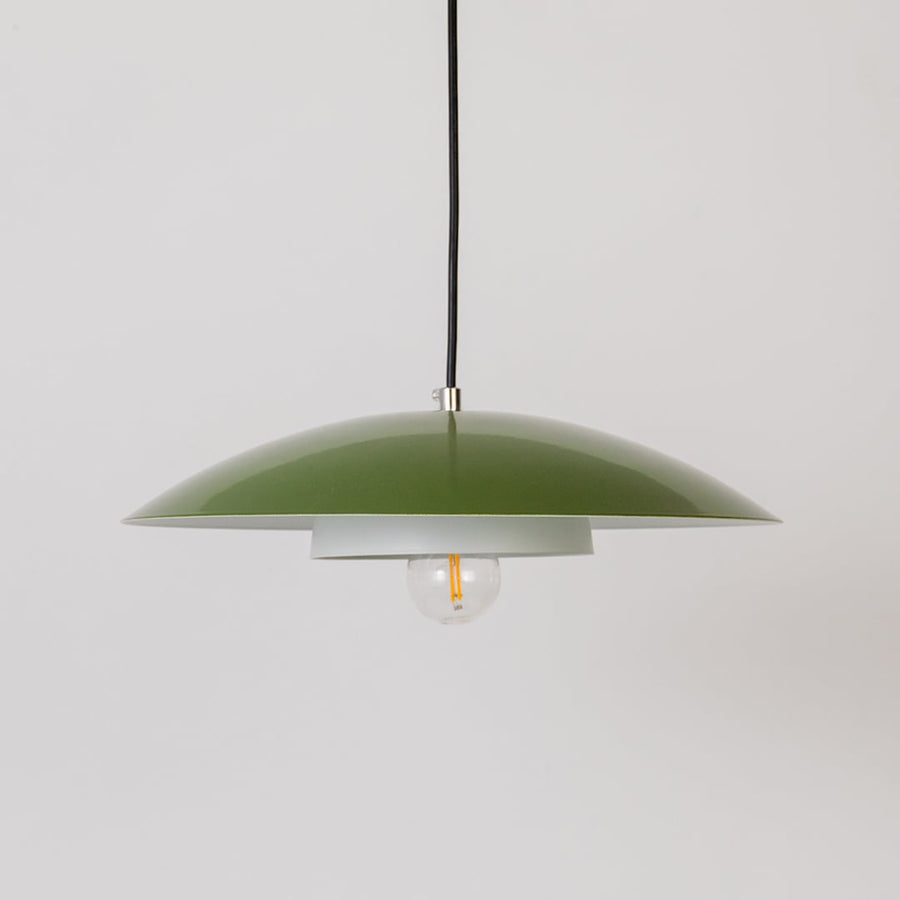 Green metal pendant light with bulb off shown on white background for modern kitchen dining and living room decor.
