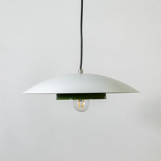 White metal pendant light with bulb off and green inner plate shown on white background for modern home interior decor.