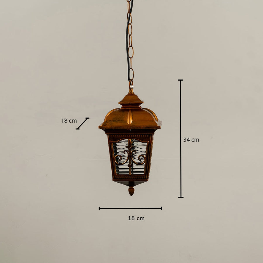 A golden hanging lantern shown with measurements 34 cm height and 18 cm width clearly marking its structured metal frame and textured decorative glass panels.