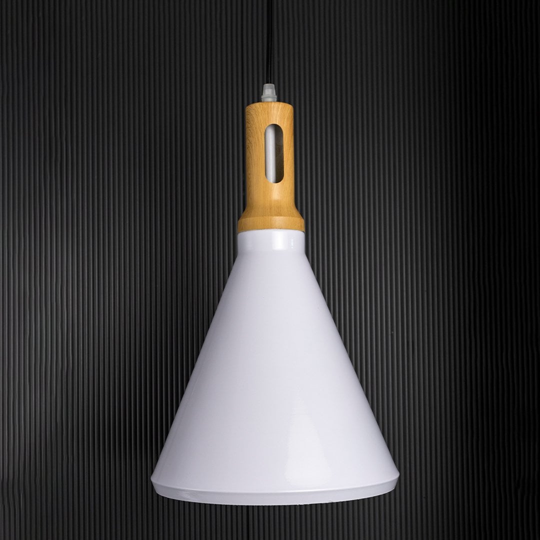 Elegant pendant light with the light on creating a warm focused glow from the cone shade and wooden accent set against a dark black background for strong contrast.