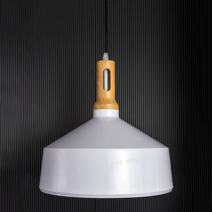 A white pendant light with a wooden top shown off against a dark black background emphasizing its sleek outline and smooth minimalist form.