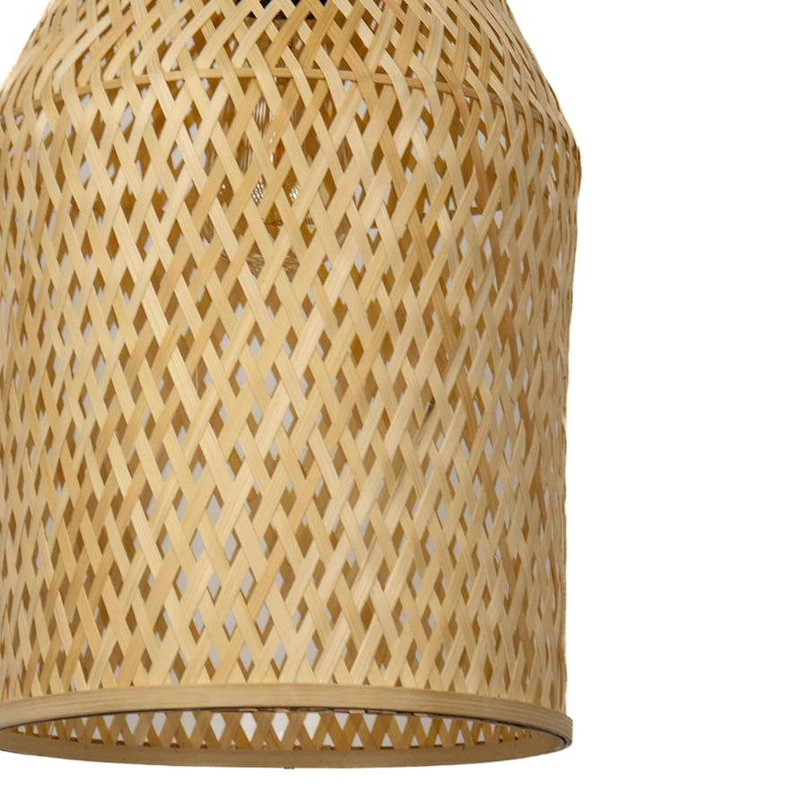 Closeup of woven bamboo pendant light with tall cylindrical wicker shade designed for rustic bohemian home decor.