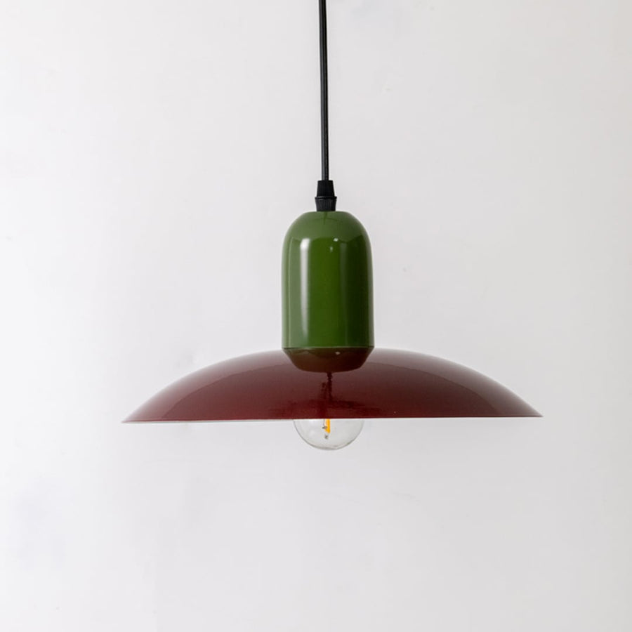 Green and burgundy metal pendant light with wide shade design for modern ceiling interiors.