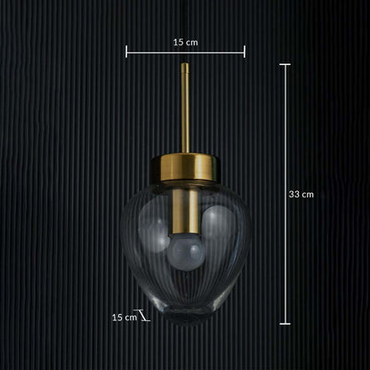Heart-shaped glass pendant light with gold fitting shown on a dark background with measurements of 15 cm width and 33 cm height.