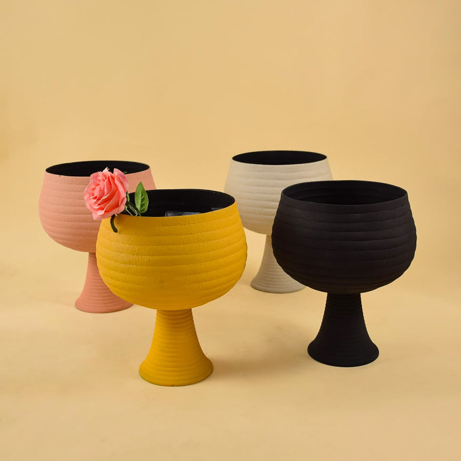 Set of cream metal pedestal bowls displayed together showing modern textured design ideal for centre tables and consoles.