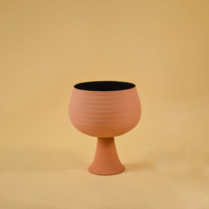 Terracotta metal pedestal bowl decor on a clean white background highlighting its warm textured finish for home styling.