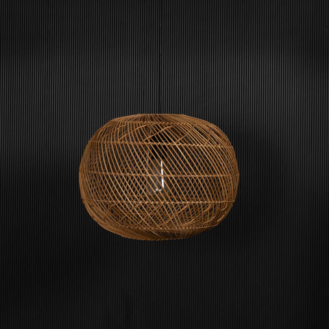 Rattan pendant light on black background emphasizing intricate woven pattern and natural craftsmanship.