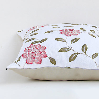 White cotton cushion cover with pink floral botanical print featuring premium cotton fabric and elegant stitched finish.