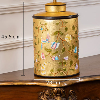 Table lamp with yellow floral ceramic base presented with 45.5 cm height and 23 cm width measurement details.