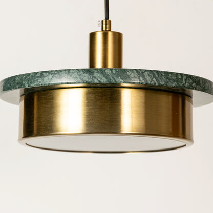 Green marble and gold metal pendant light illuminated to display premium decorative ceiling lighting with refined appeal.