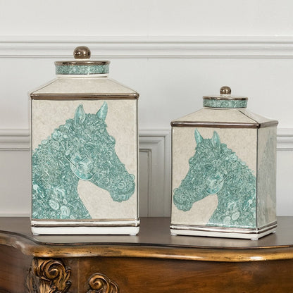 White ceramic jars with green horse artwork placed neatly on a wooden console table adding an elegant decorative accent that enhances the interior décor style.