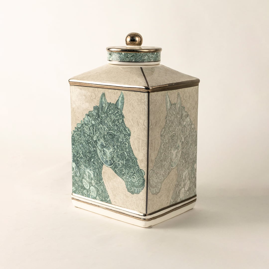 White ceramic jar with green textured horse design in a close-up view ideal for contemporary décor styling and elegant home accents.