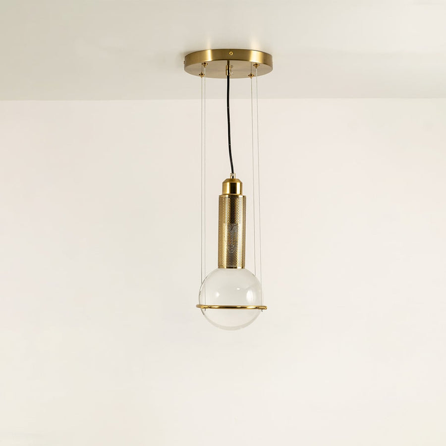 Pendant light with frosted glass globe and metal cylinder shown switched off on a clean white background highlighting its modern sculptural shape for interior decor styling.